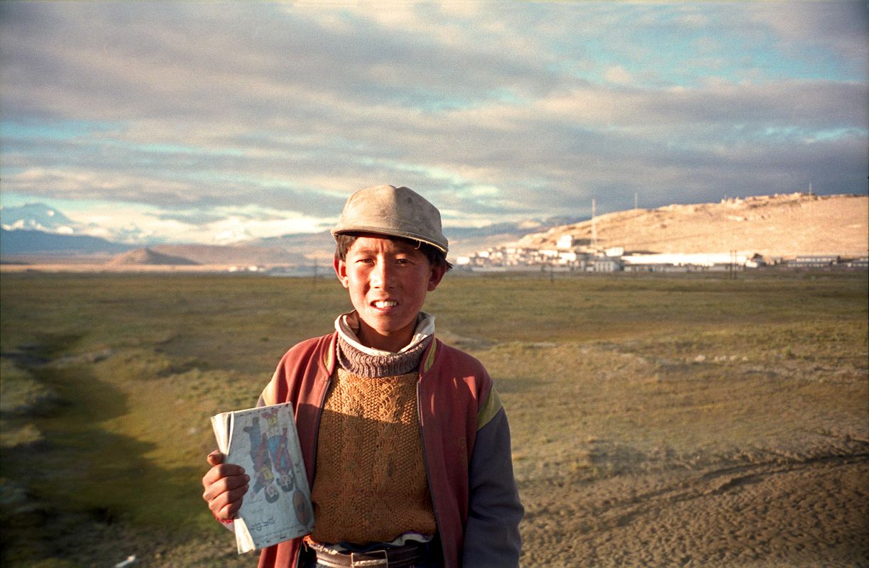 15 Boy On His Way To School In Tingri In 1998 A young boy showed me his books on his way to school in Tingri in 1998.